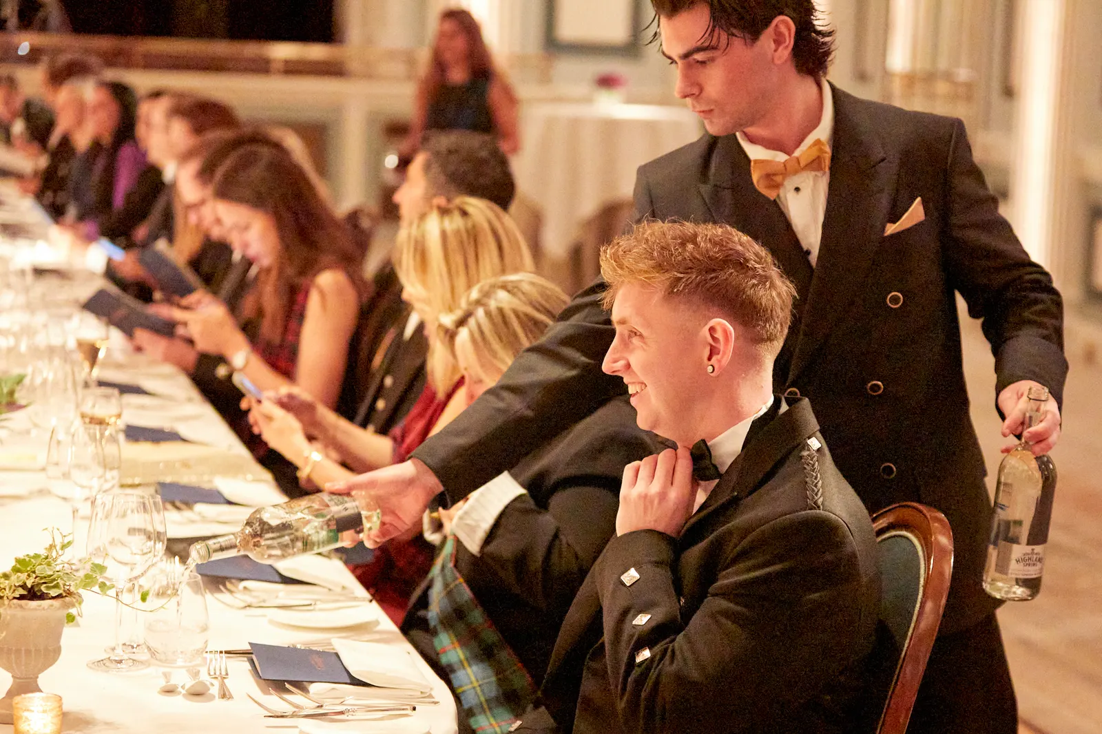 Candid guest moment during dinner service at a Gleneagles corporate evening