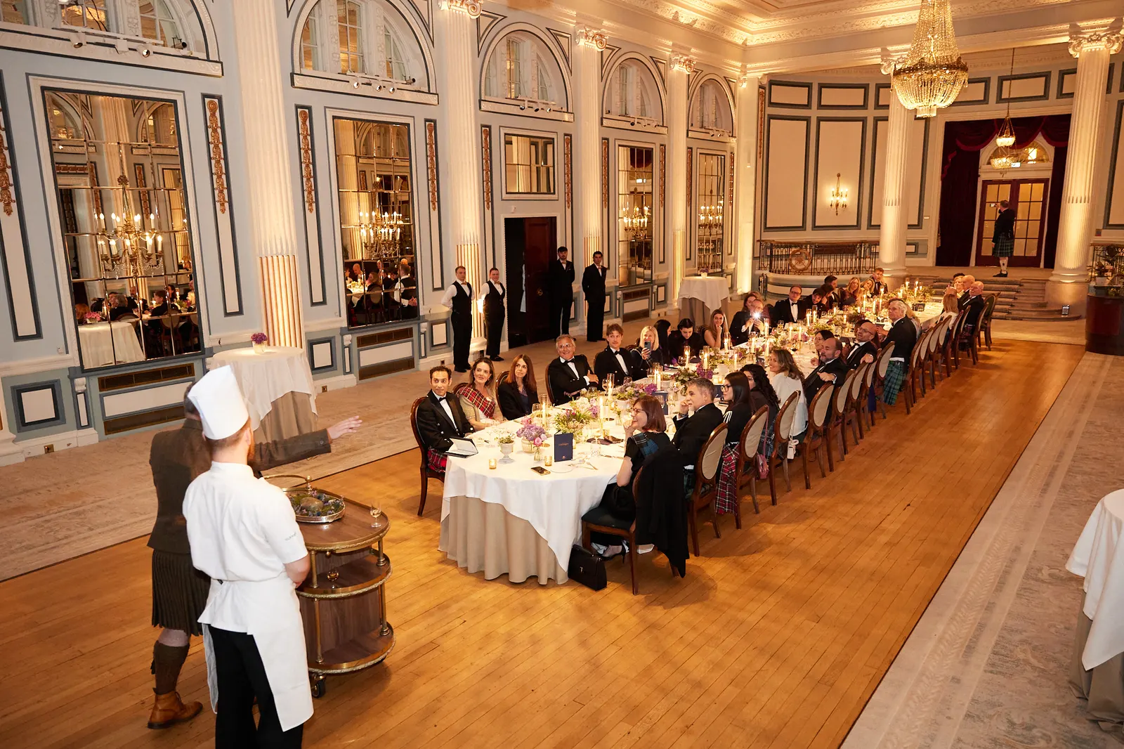 Chef presenting haggis to guests at a corporate dinner in the Gleneagles ballroom