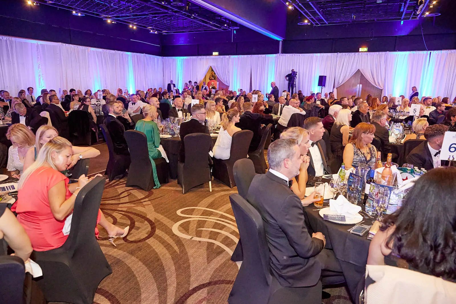 Ballroom filled with guests at a black-tie charity ball in Newcastle