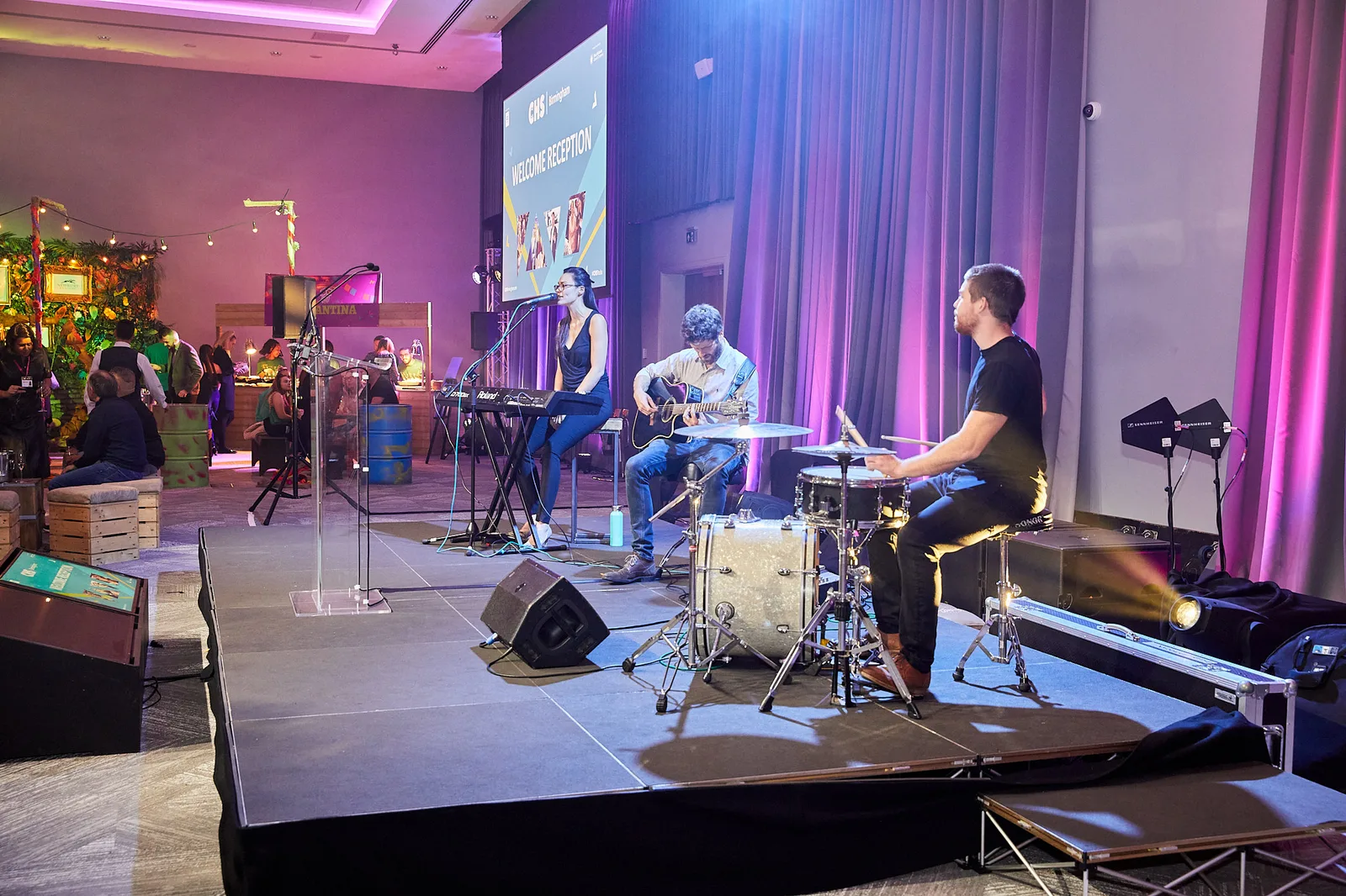 Live band performing on stage at a conference welcome reception in Birmingham