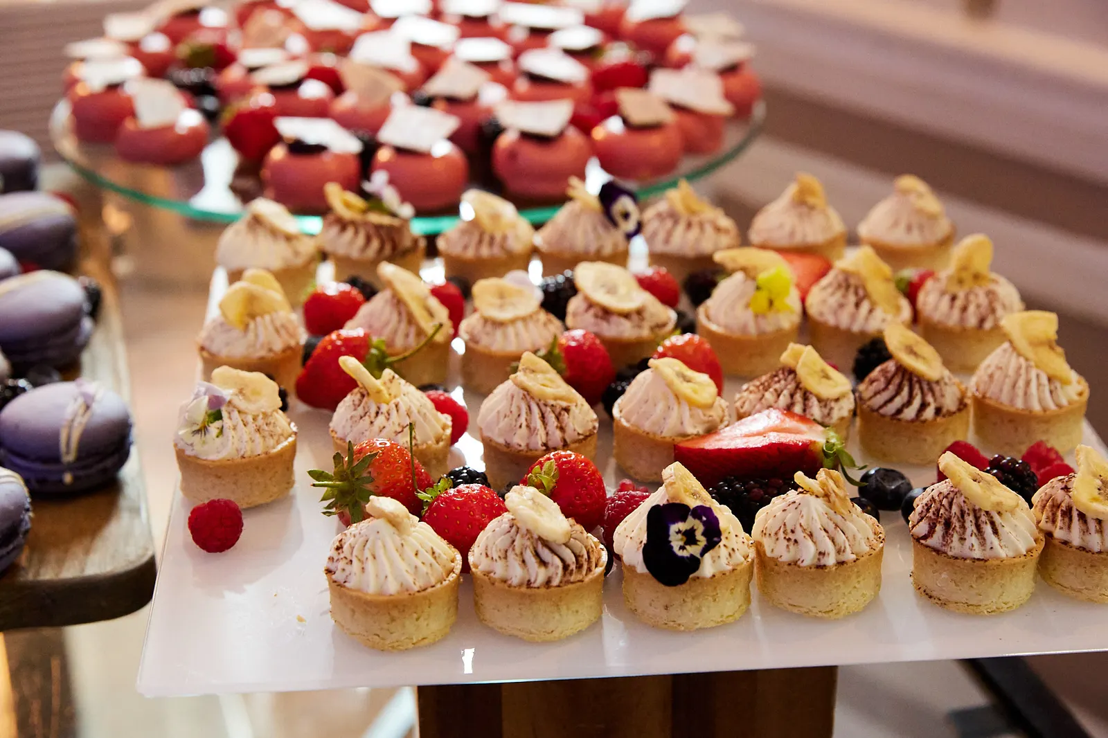 Dessert canapés with fresh berries and edible flowers served at a corporate conference in Edinburgh