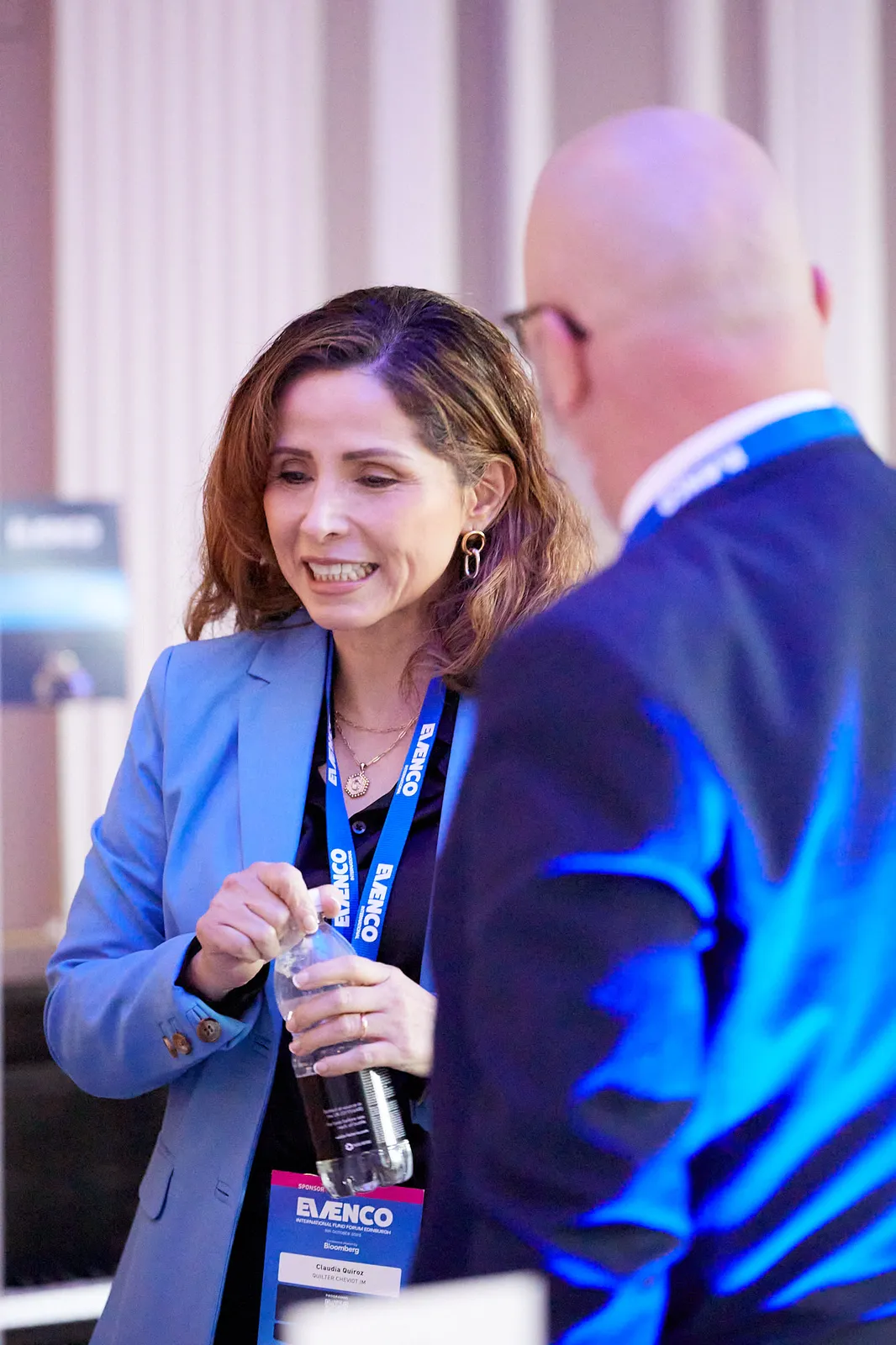 Delegates in conversation between sessions at a conference