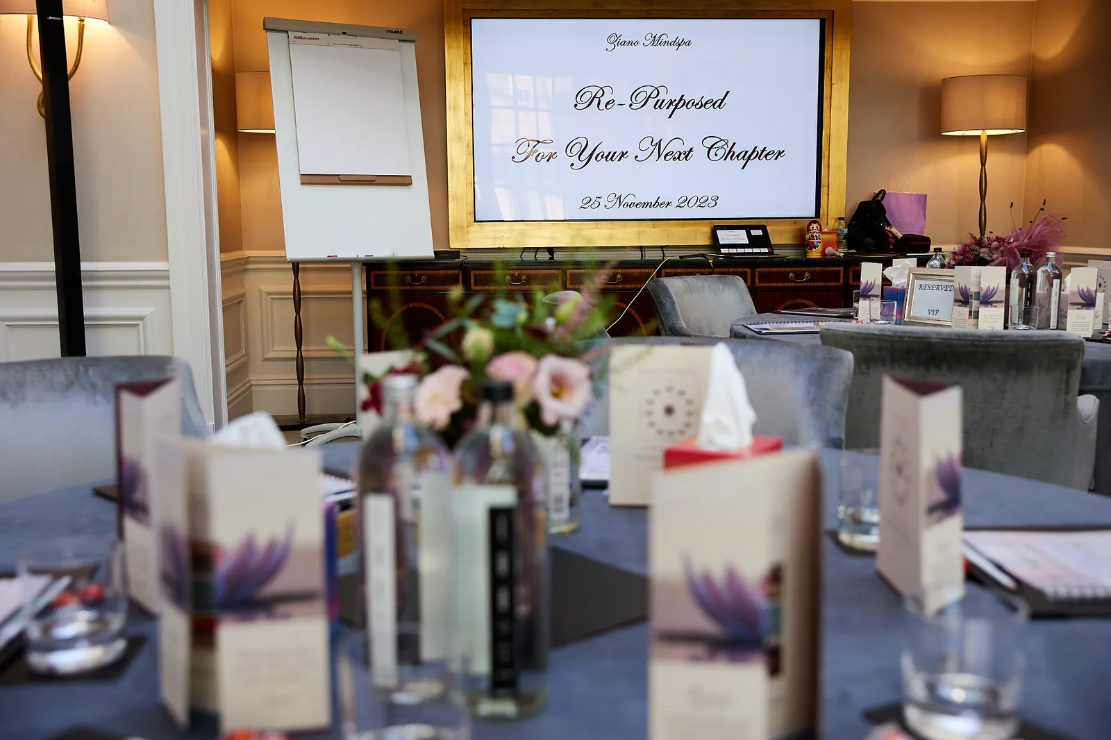 Styled table with fresh flowers and menu cards at a corporate event