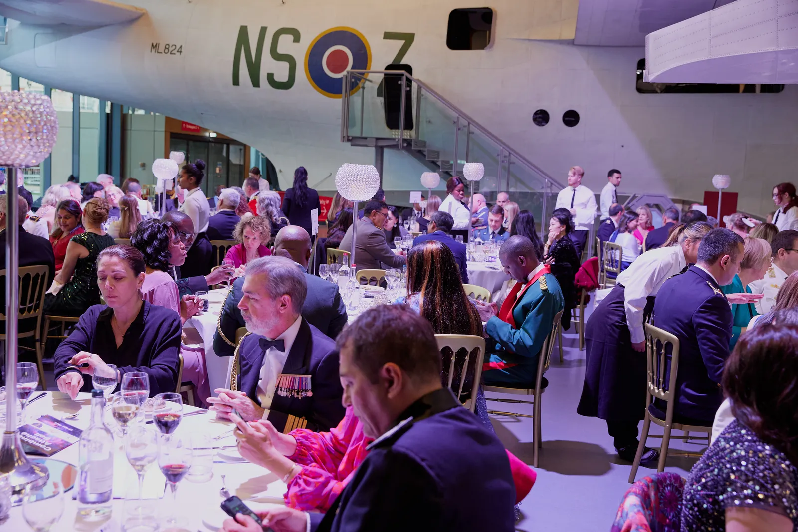 Black-tie awards dinner in a grand hangar venue