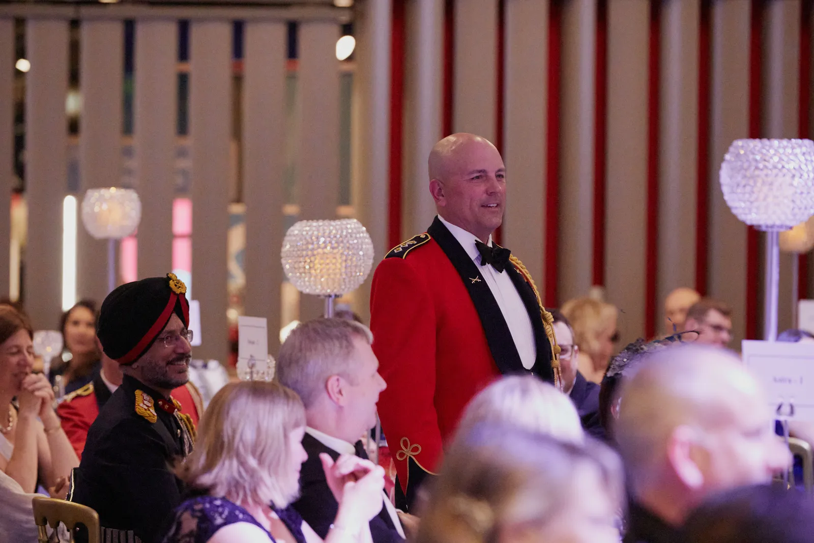 Guests in evening dress at a black-tie gala dinner