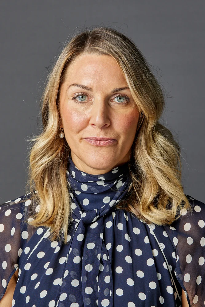 Professional corporate headshot of a team member