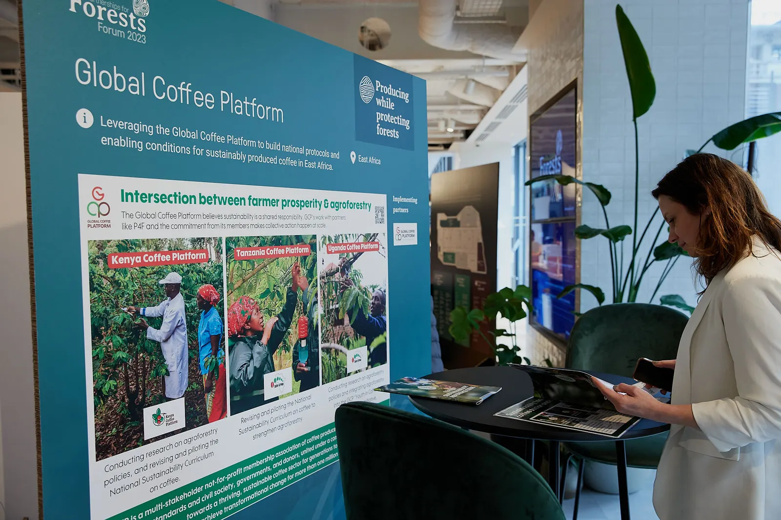 Delegate browsing materials at an exhibition stand