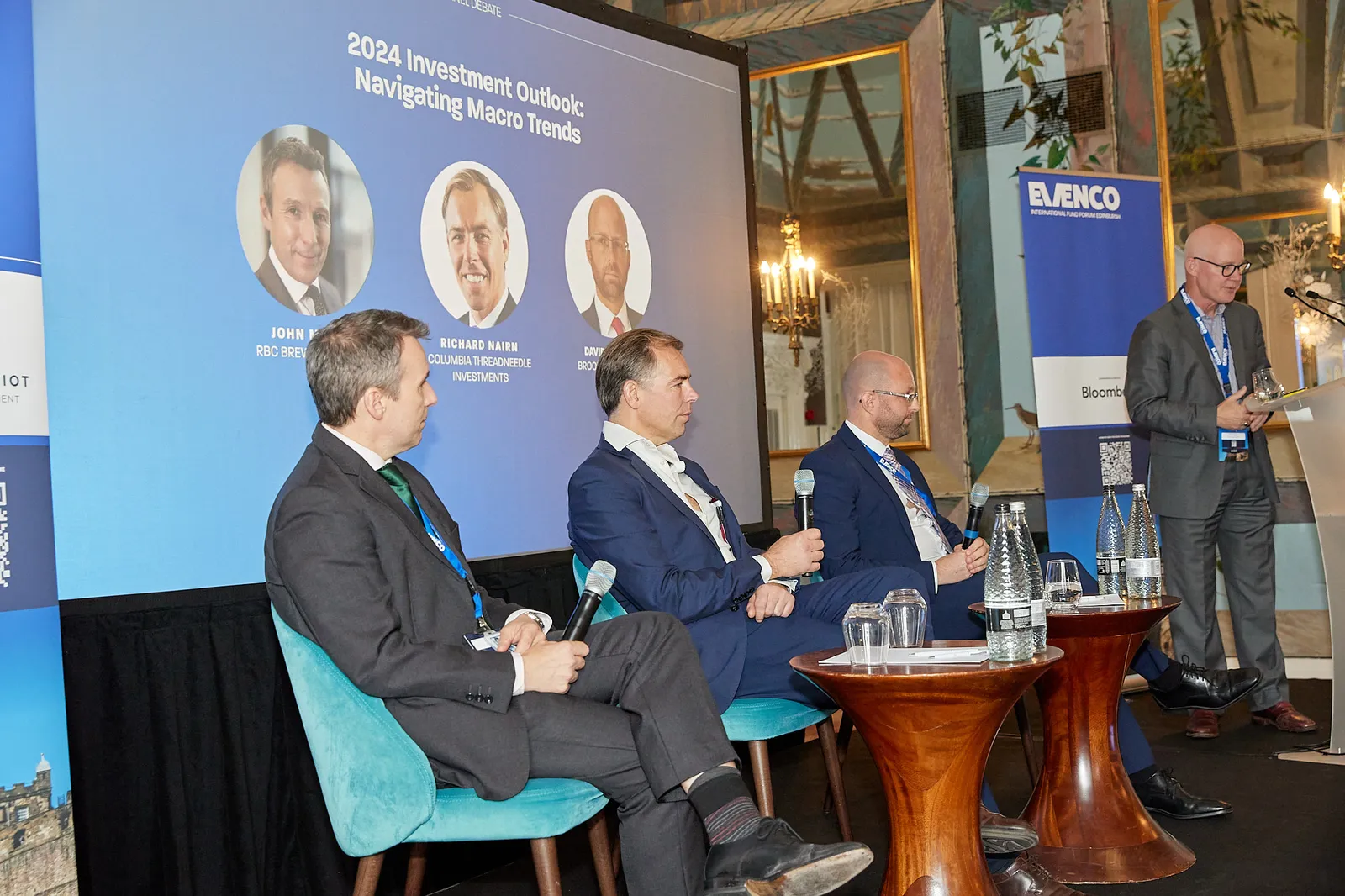 Panel discussion on stage at a corporate conference
