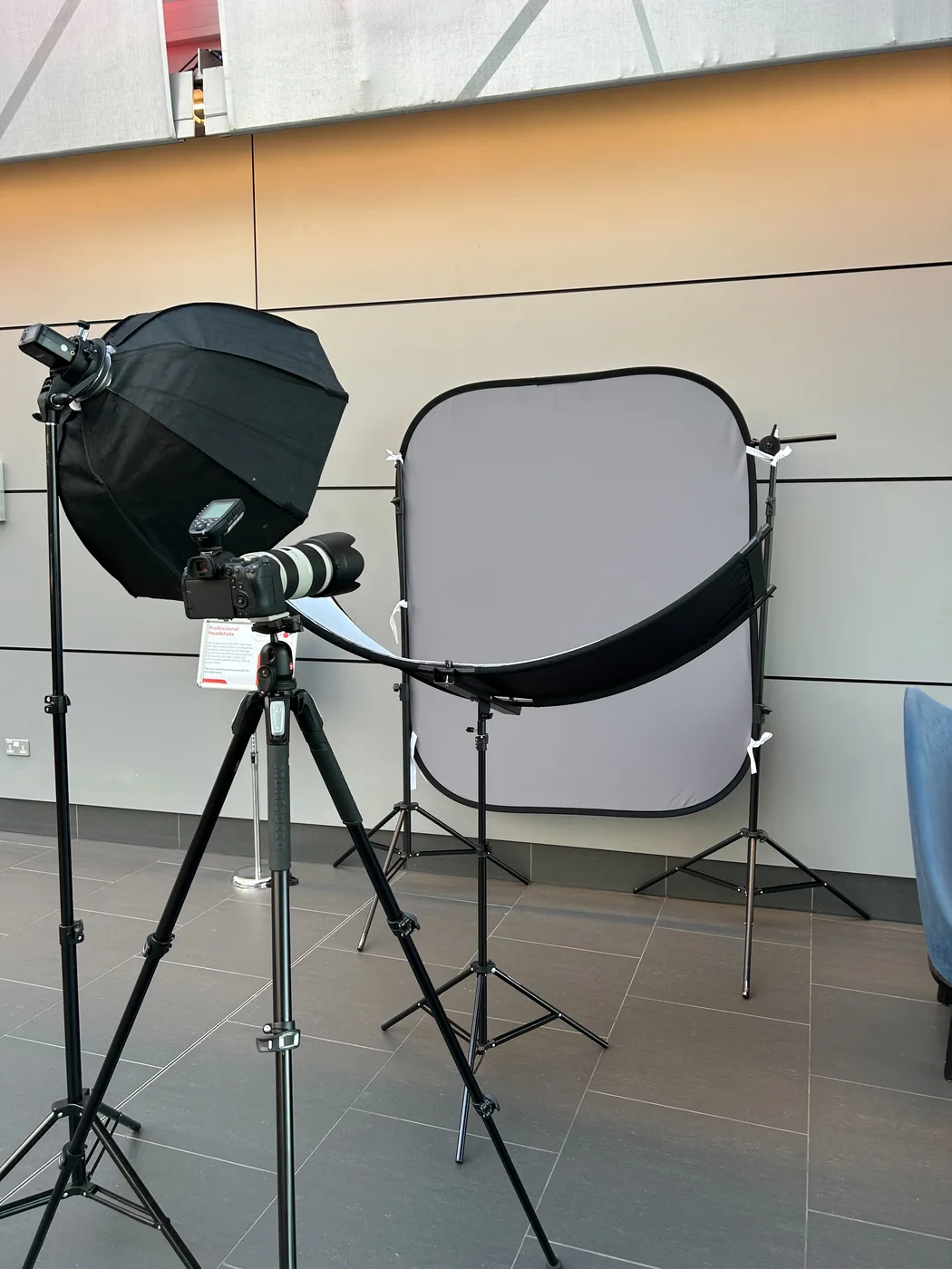 Photo 8 mobile headshot studio — camera, lighting and backdrop — set up at a corporate event