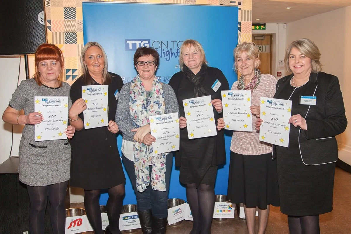 Prize winners photographed at a travel-trade evening event