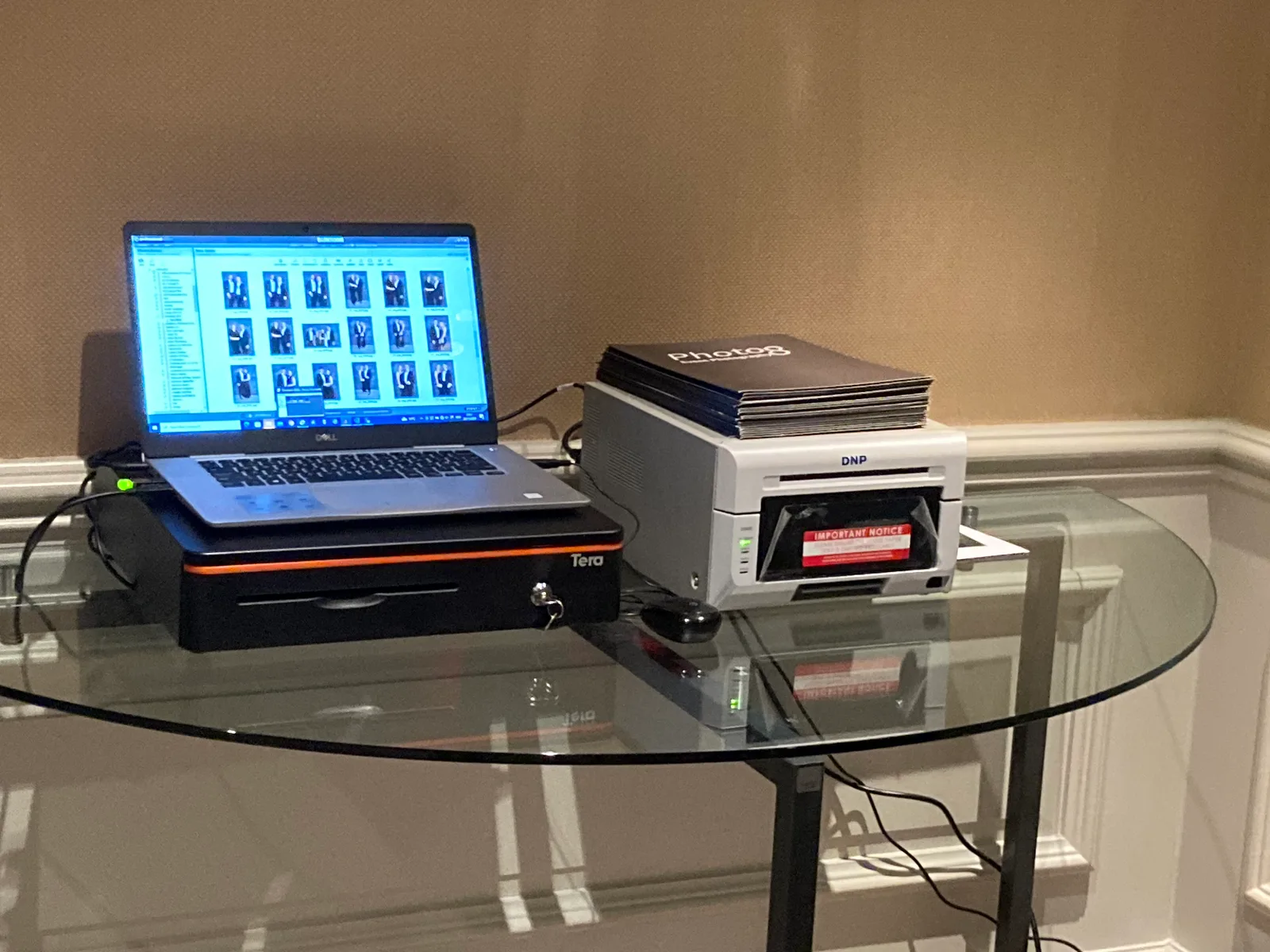 Photo 8 instant print station with DNP printer and branded print folders